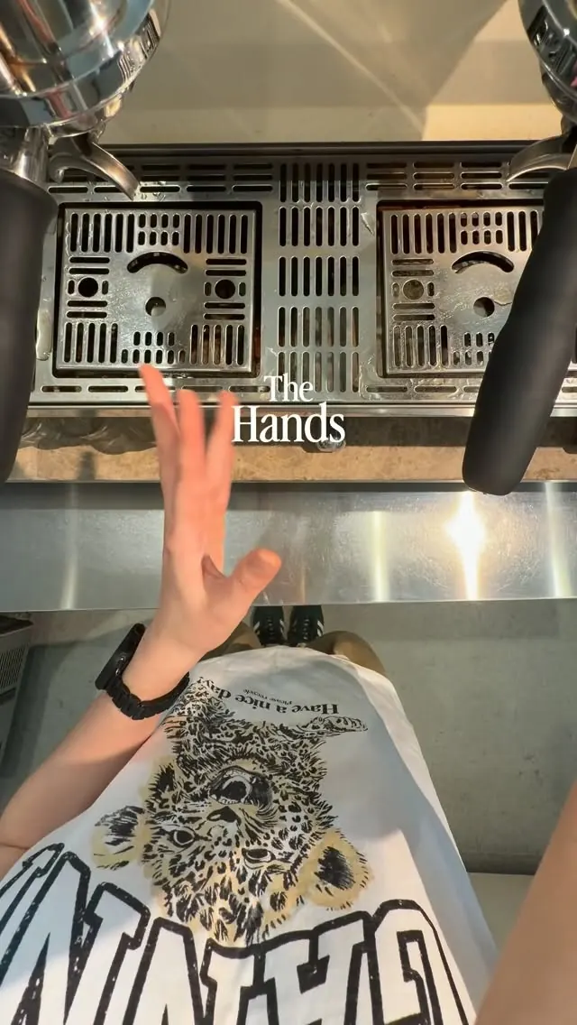 The cover of FAVE’s The Art reel: a raised hand in front of the espresso machine, with the title The Hands